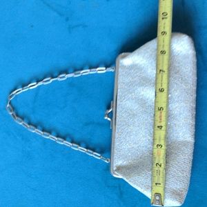 Kenneth Cole Reaction shimmery clutch bag